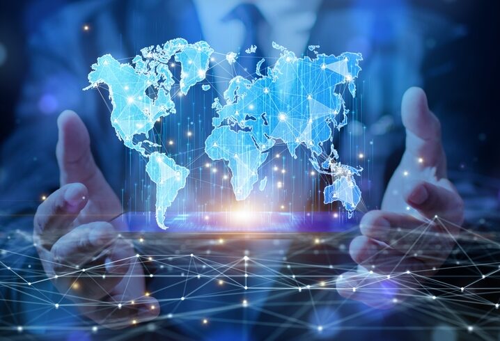 The,Businessman,Is,Holding,A,Smartphone,With,Map,And,Social